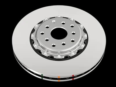 Disco freno DBA Serie 5000 HD caratterizzato da una finitura liscia in stile OE con superficie argentata, mozzo di montaggio centrale e contrassegni indicatori colorati