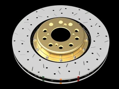 Disco freno DBA Serie 5000 XS con fori incrociati e scanalature su superficie argentata caratterizzato da mozzo centrale dorato e contrassegni indicatori colorati